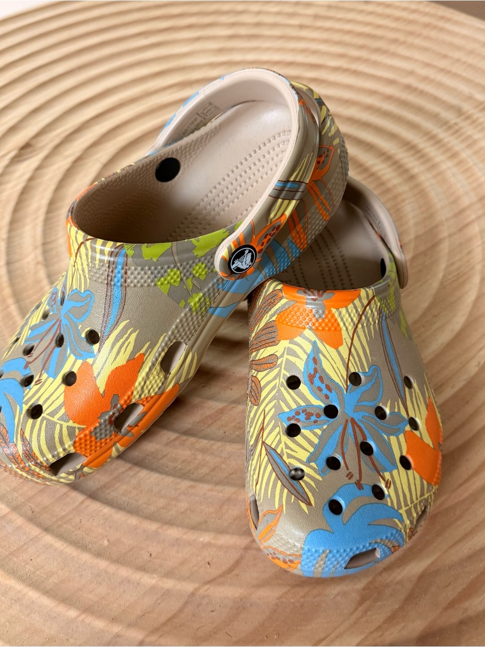 CROCS women's classic Floral Clogs in Tan with Orange & Blue Accents